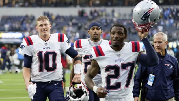Patriots QB Mac Jones (10) and Cornerback J.C. Jackson (27)